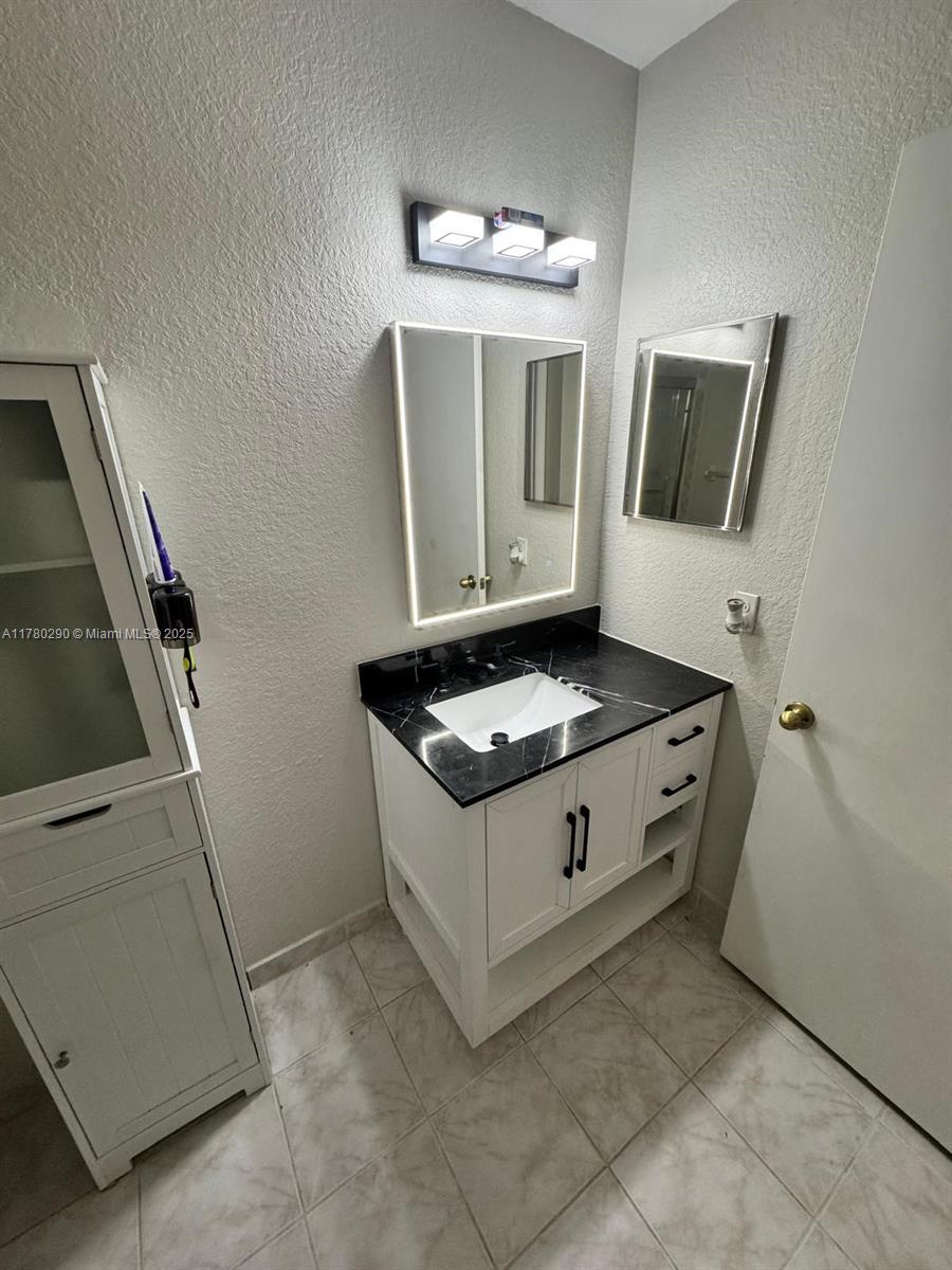 Richmond Heights Miami, FL 33176 - Photo 4 of 7 a white stove top oven and sink