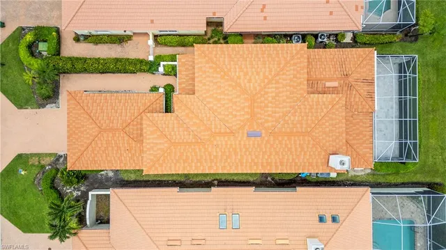 an aerial view of residential building and lake