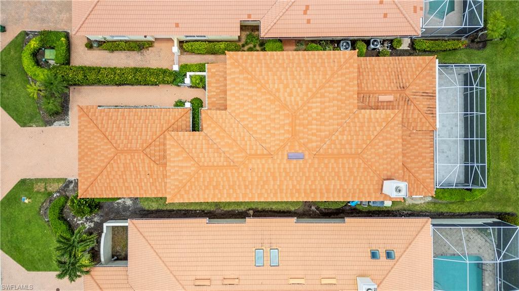 11448 Quail Village Way Naples, FL 34119 - Photo 2 of 41 an aerial view of residential building and lake