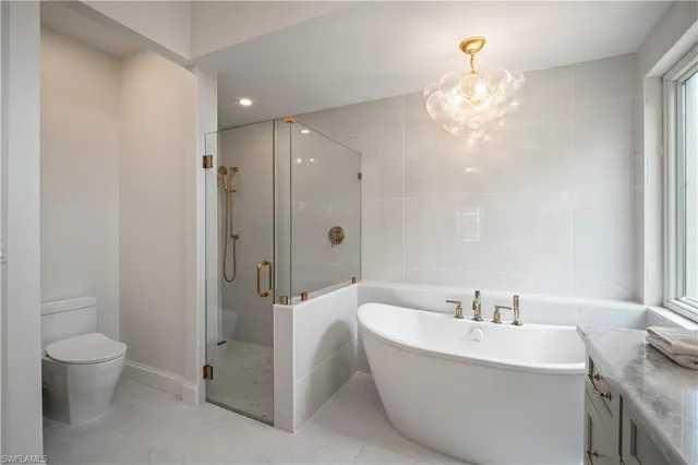 a bathroom with a bathtub a sink and a toilet