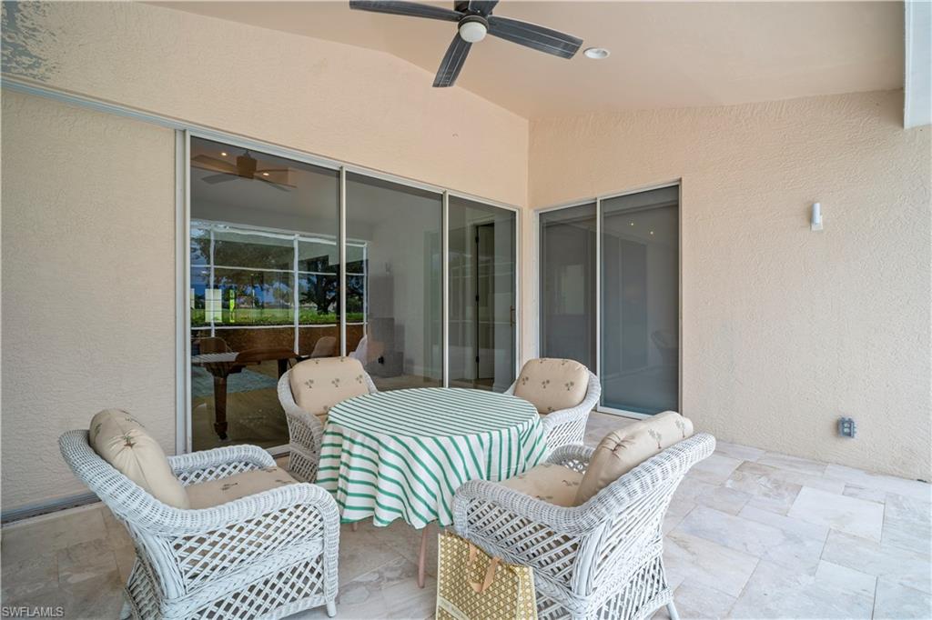 11448 Quail Village Way Naples, FL 34119 - Photo 38 of 41 a bedroom with furniture and a window
