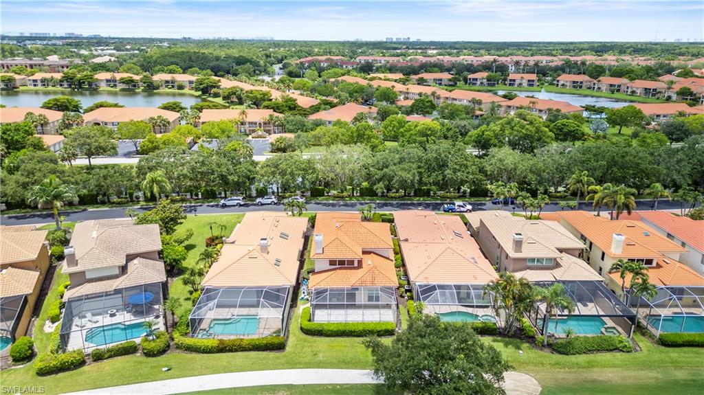 11448 Quail Village Way Naples, FL 34119 - Photo 4 of 41 an aerial view of residential houses with outdoor space and swimming pool