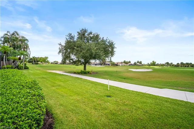a view of a golf course with a lake view