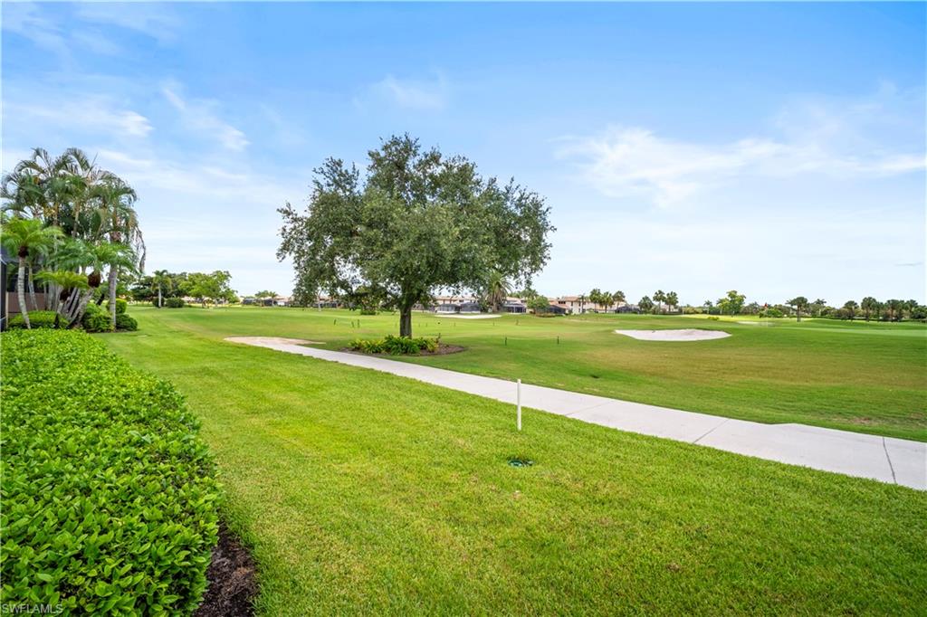 11448 Quail Village Way Naples, FL 34119 - Photo 41 of 41 a view of a golf course with a lake view