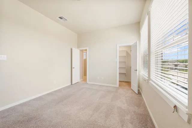 a view of an empty room with a large window