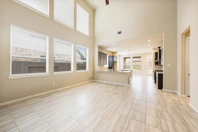 a kitchen with a sink and large window