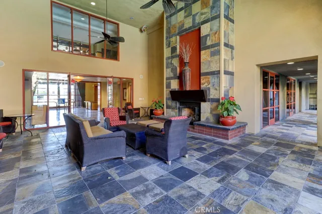 a living room with furniture and a potted plant