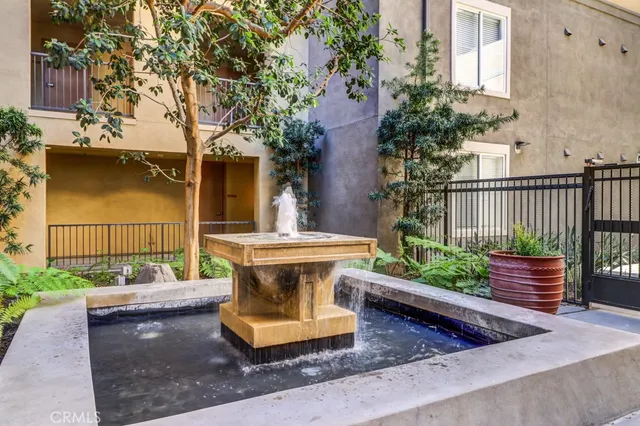 a view of a bench in back yard of the house