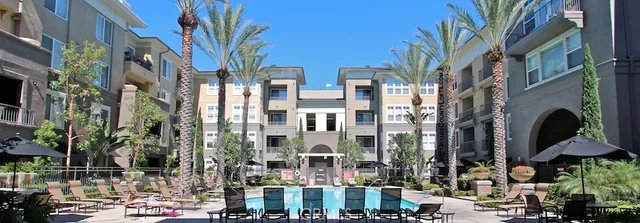 a view of a street with tall buildings
