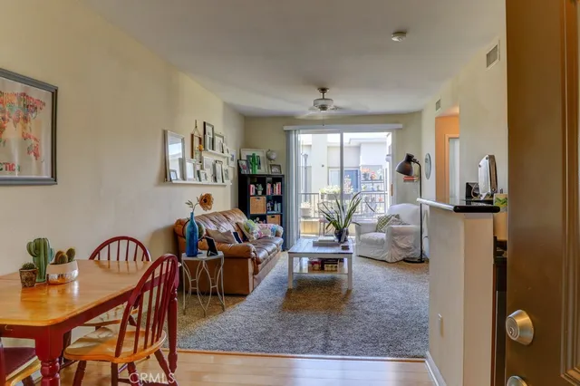a living room with furniture rug and window
