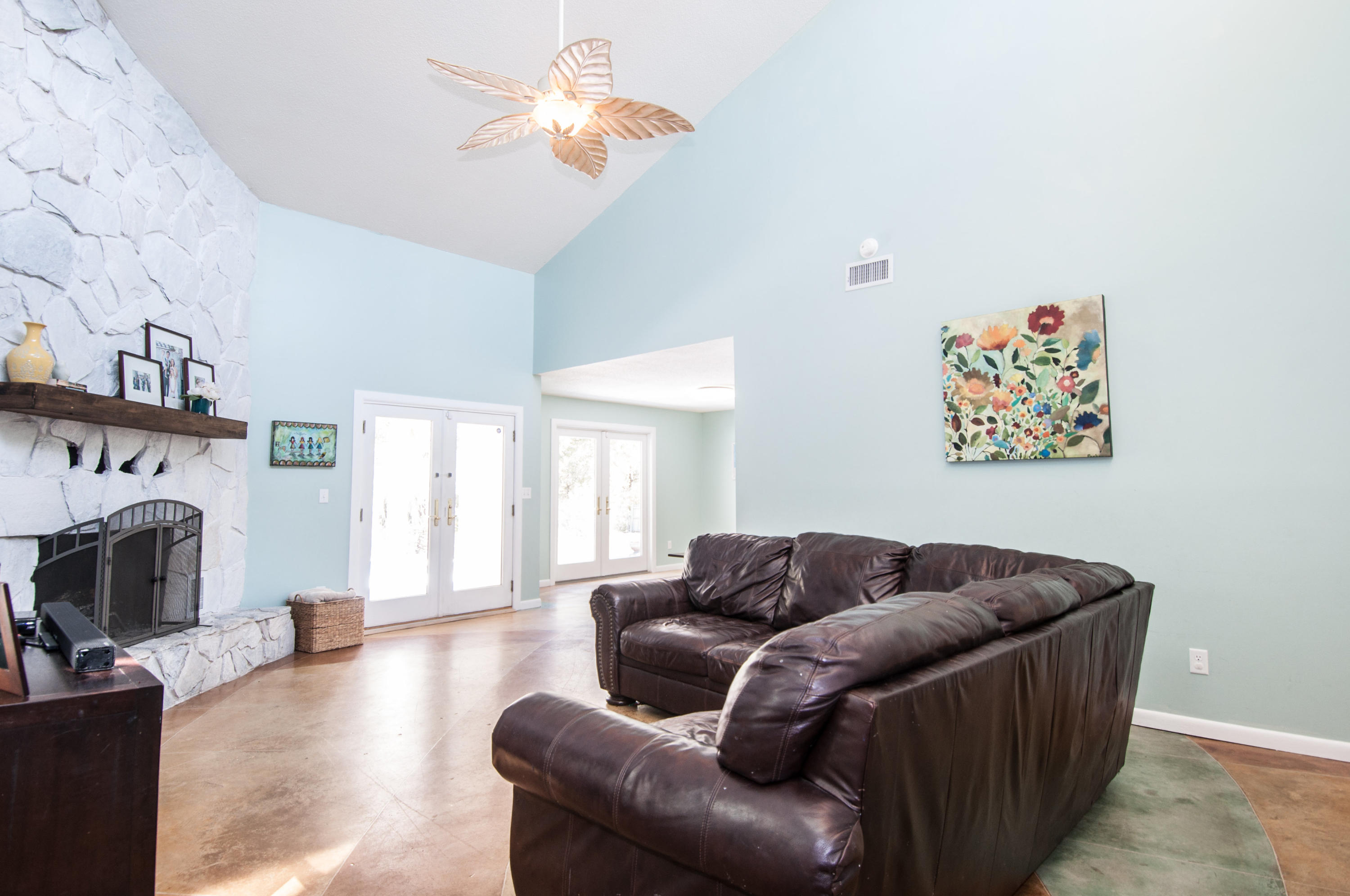 255 Ridge Lake Road Crestview, FL 32536 - Photo 14 of 54 a living room with furniture and a fireplace