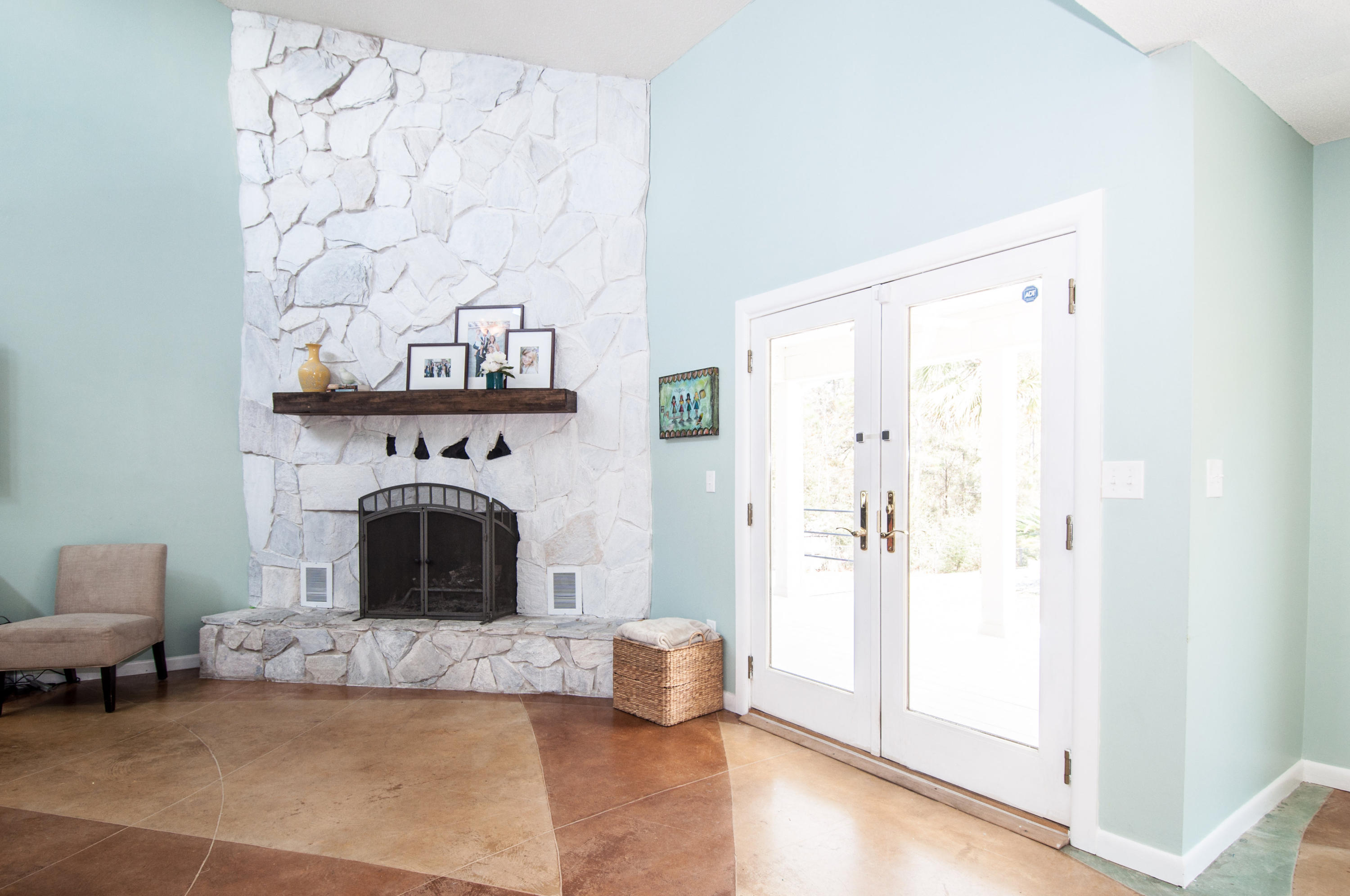 255 Ridge Lake Road Crestview, FL 32536 - Photo 16 of 54 a living room with furniture and a fireplace