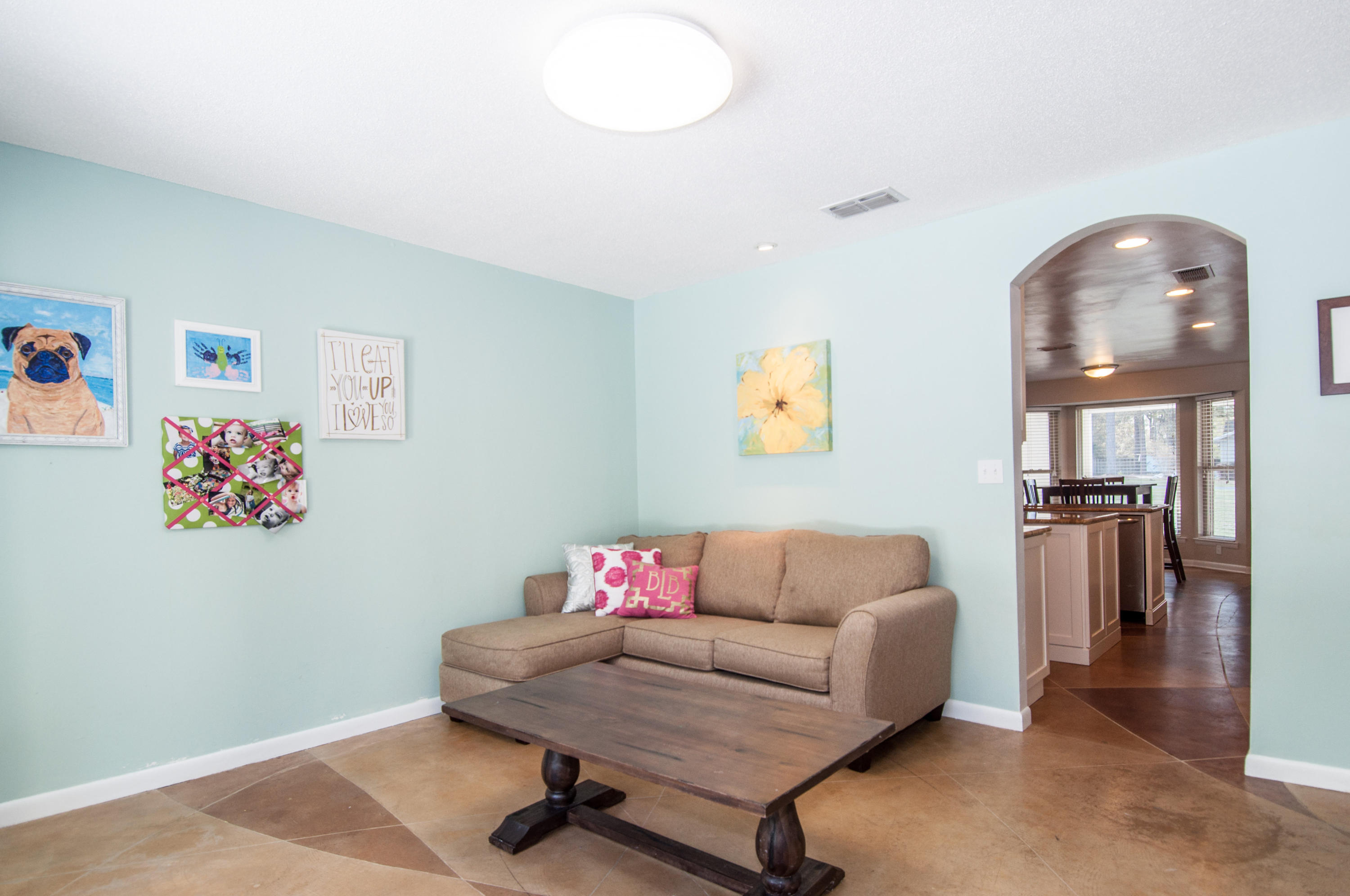 255 Ridge Lake Road Crestview, FL 32536 - Photo 19 of 54 a living room with furniture and a wooden floor