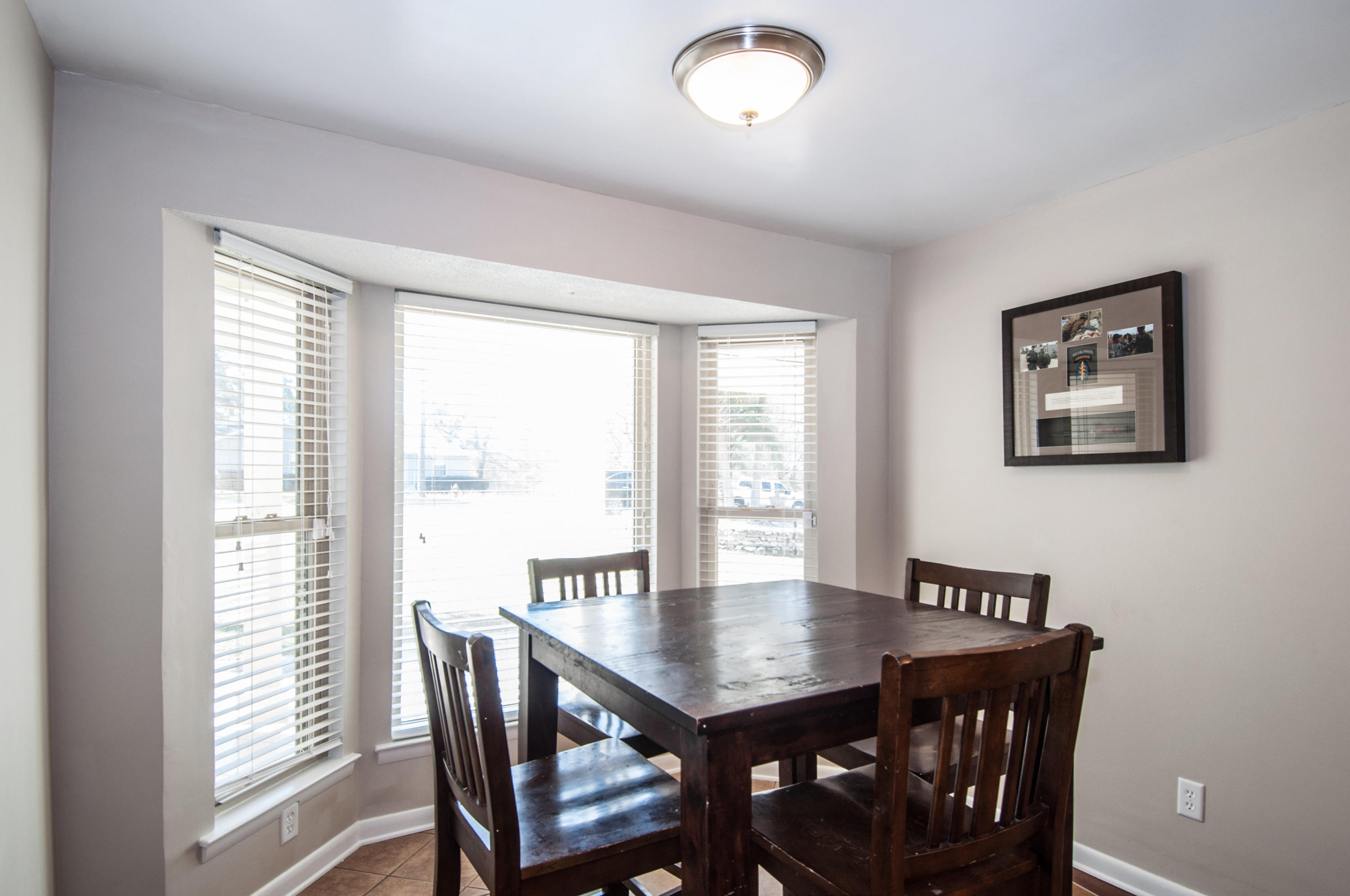255 Ridge Lake Road Crestview, FL 32536 - Photo 23 of 54 a view of a dining room with furniture window and outside view