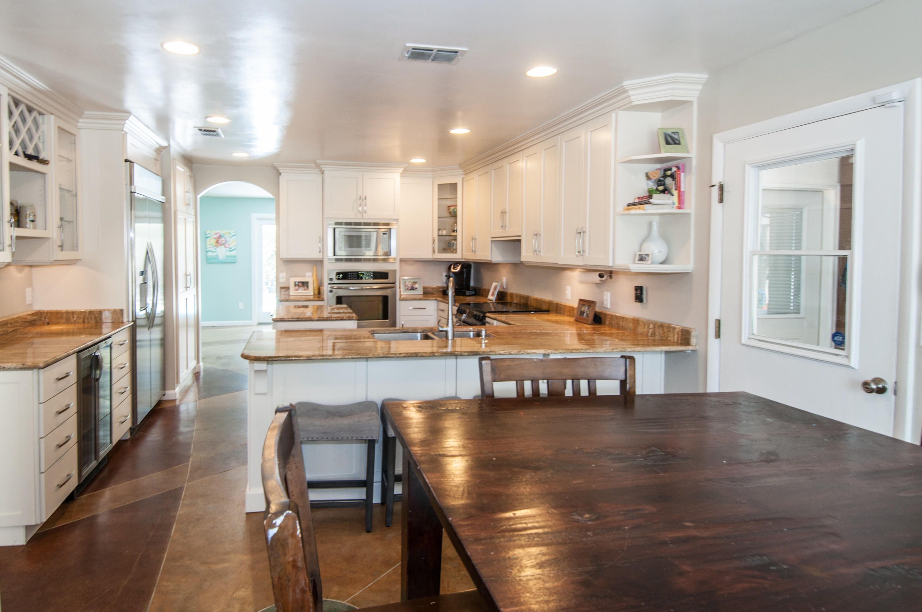 255 Ridge Lake Road Crestview, FL 32536 - Photo 24 of 54 a large kitchen with a table and chairs