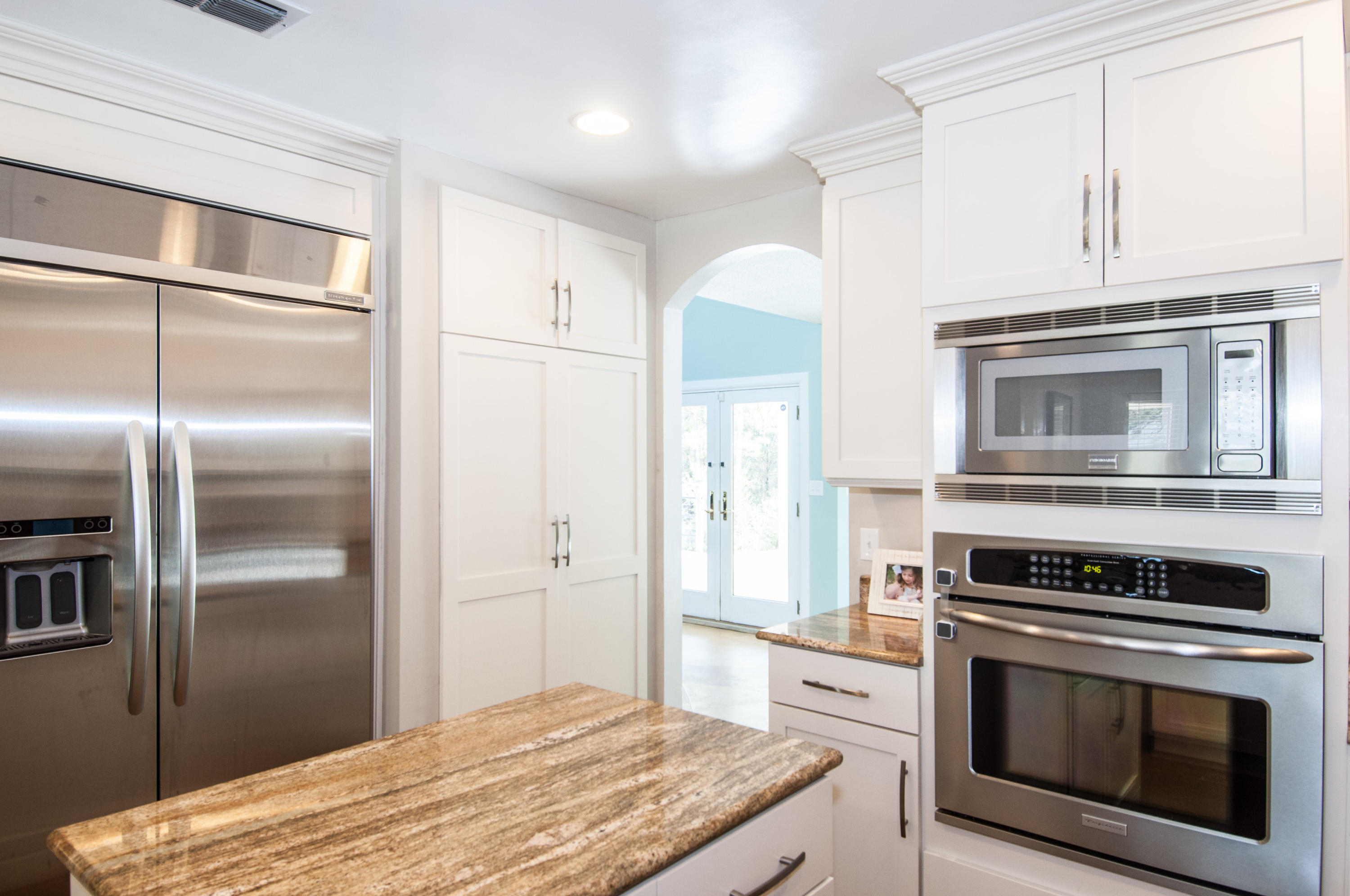 255 Ridge Lake Road Crestview, FL 32536 - Photo 28 of 54 a kitchen with stainless steel appliances granite countertop a stove and a refrigerator