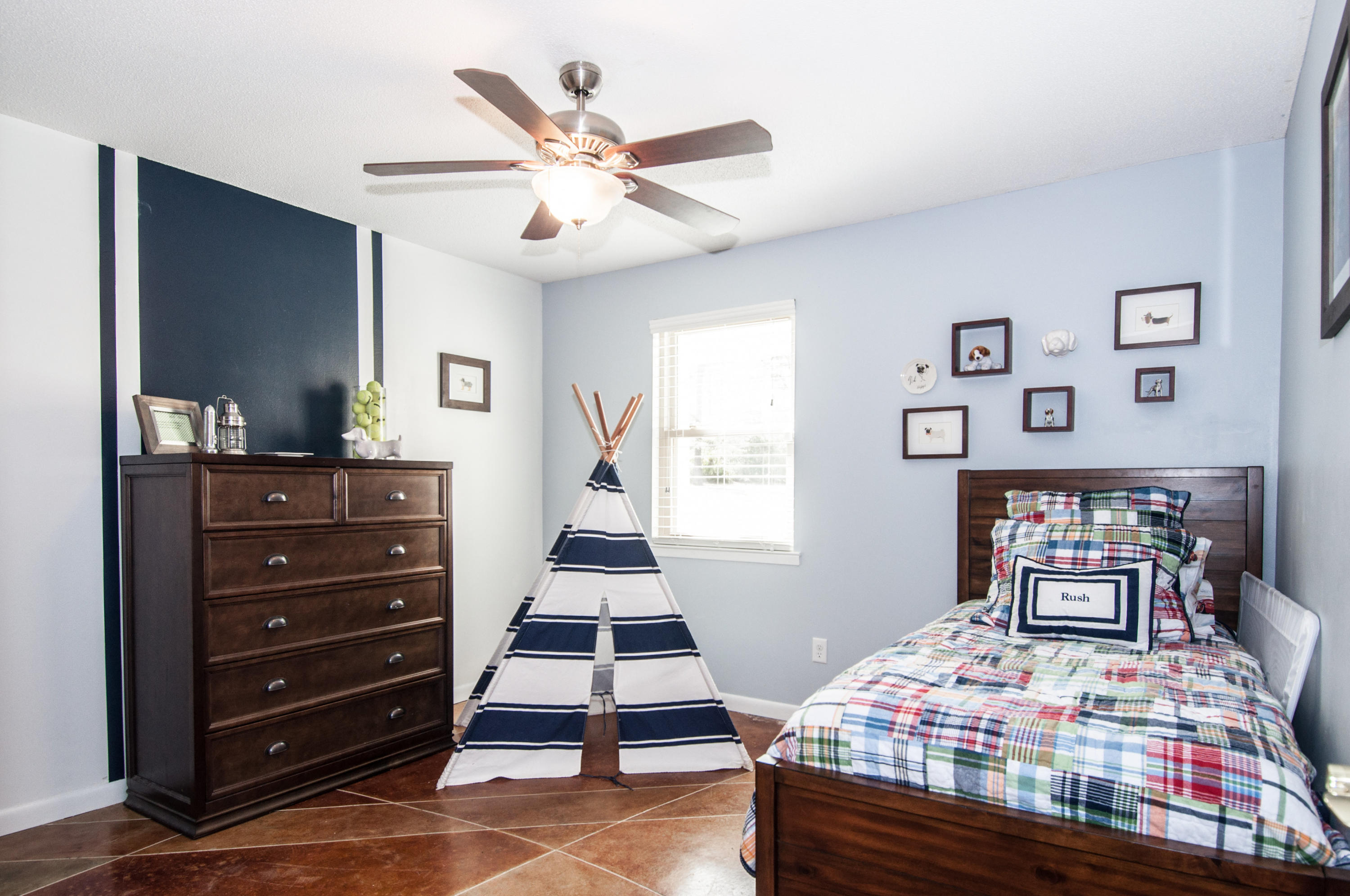 255 Ridge Lake Road Crestview, FL 32536 - Photo 30 of 54 a bedroom with a bed and furniture