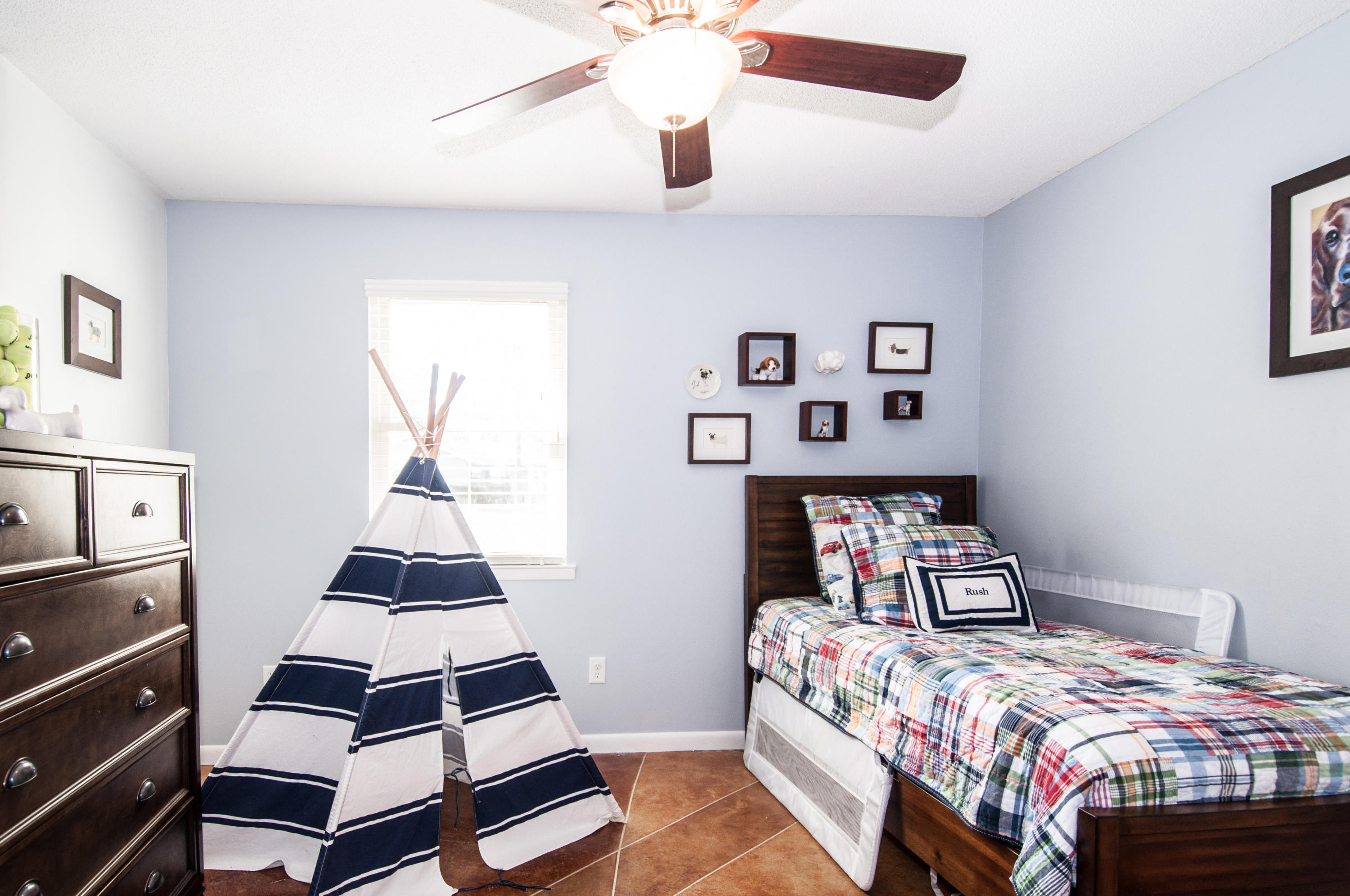 255 Ridge Lake Road Crestview, FL 32536 - Photo 32 of 54 a bedroom with a bed and a dresser