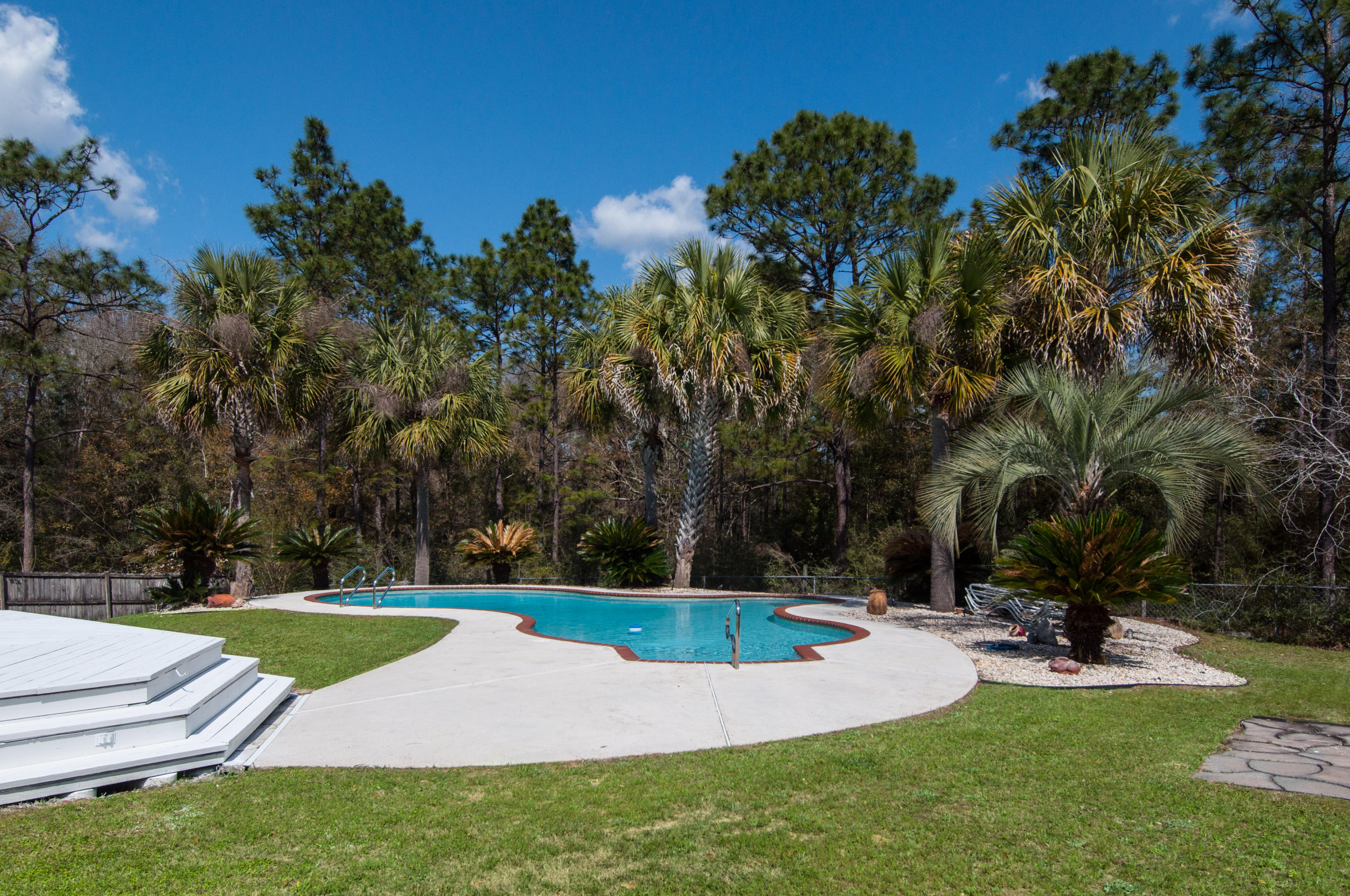 255 Ridge Lake Road Crestview, FL 32536 - Photo 4 of 54 a view of a park with large trees