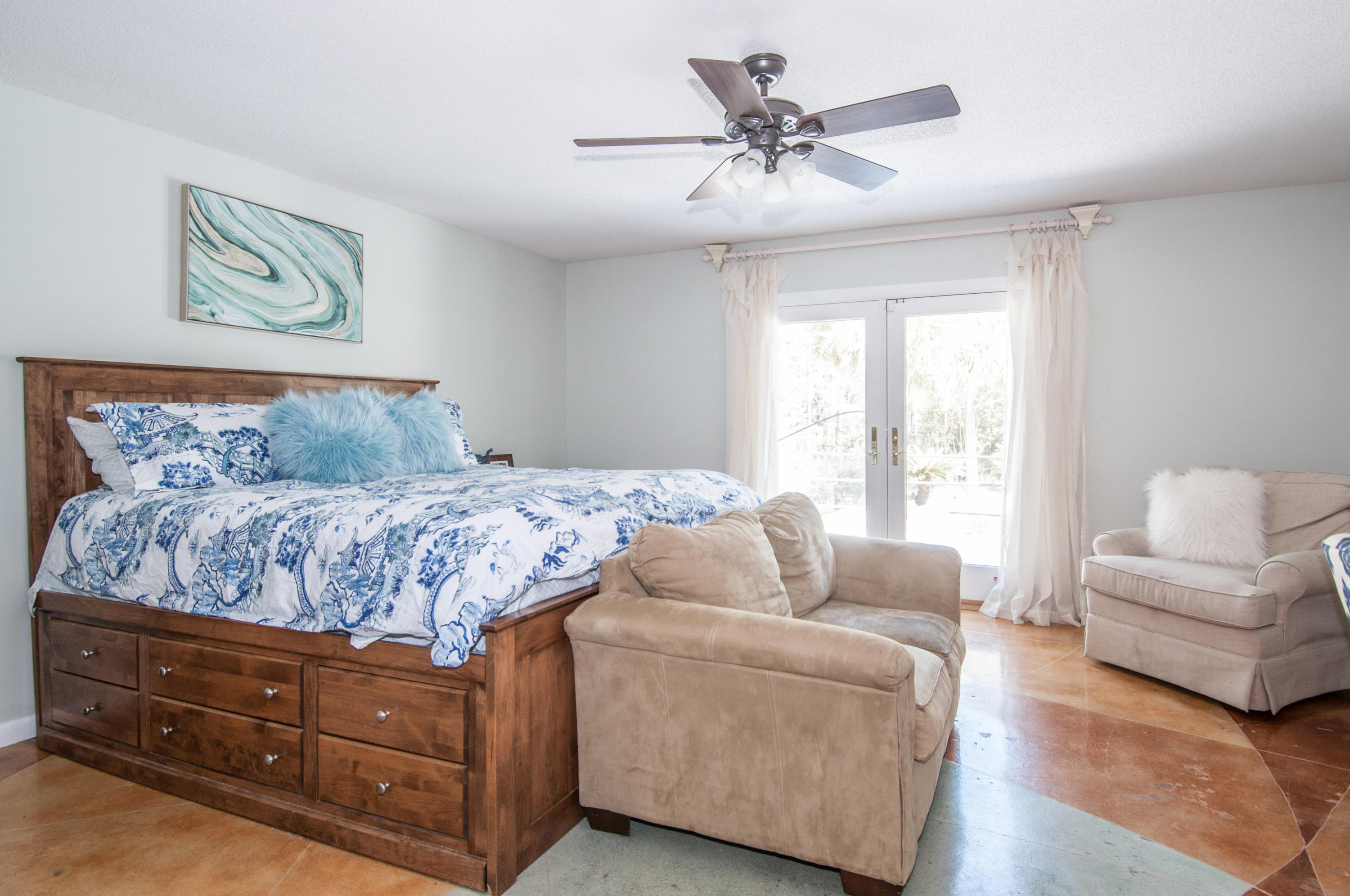 255 Ridge Lake Road Crestview, FL 32536 - Photo 44 of 54 a living room with furniture and a large window