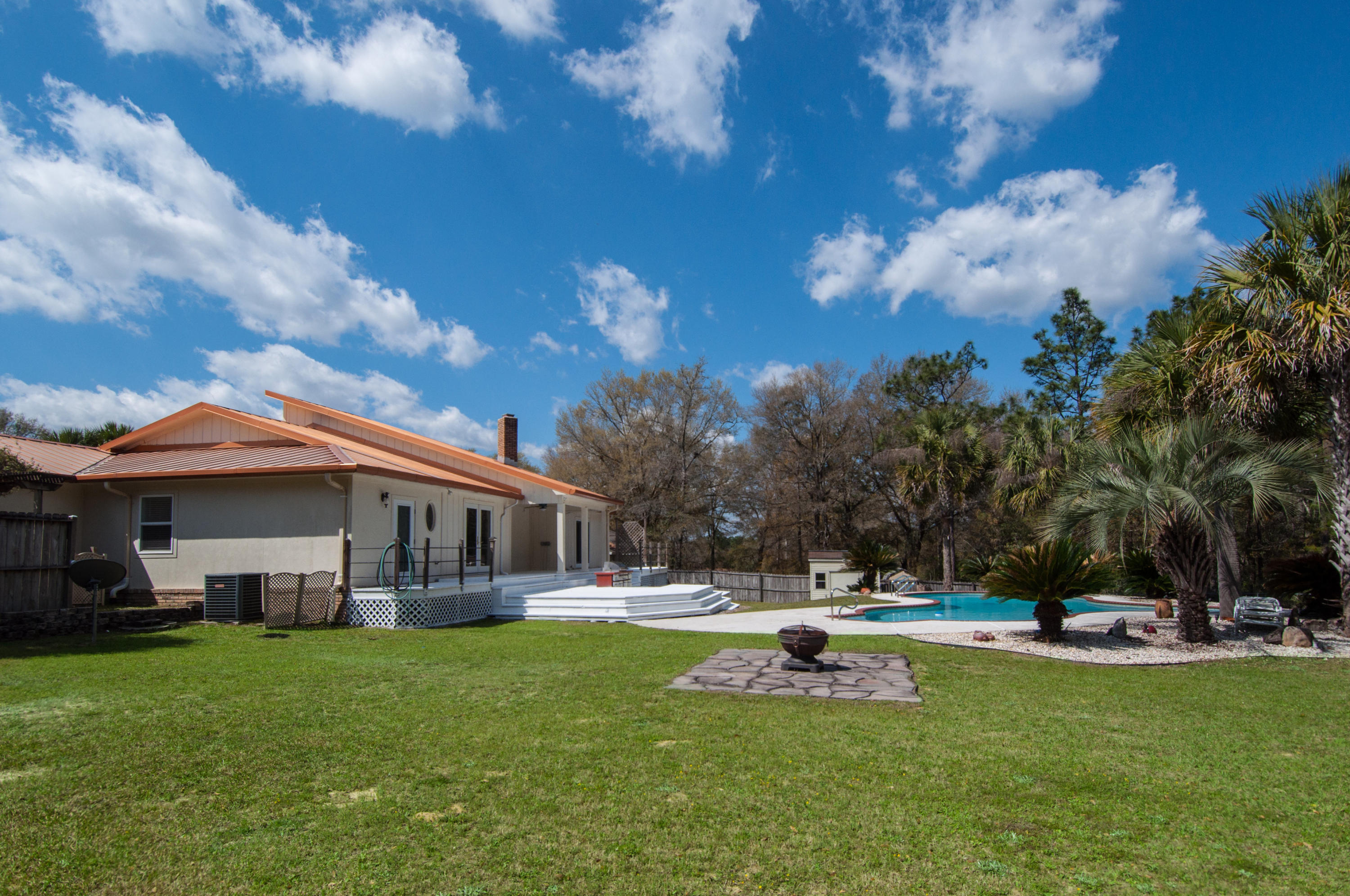 255 Ridge Lake Road Crestview, FL 32536 - Photo 5 of 54 a view of a house with swimming pool and sitting area