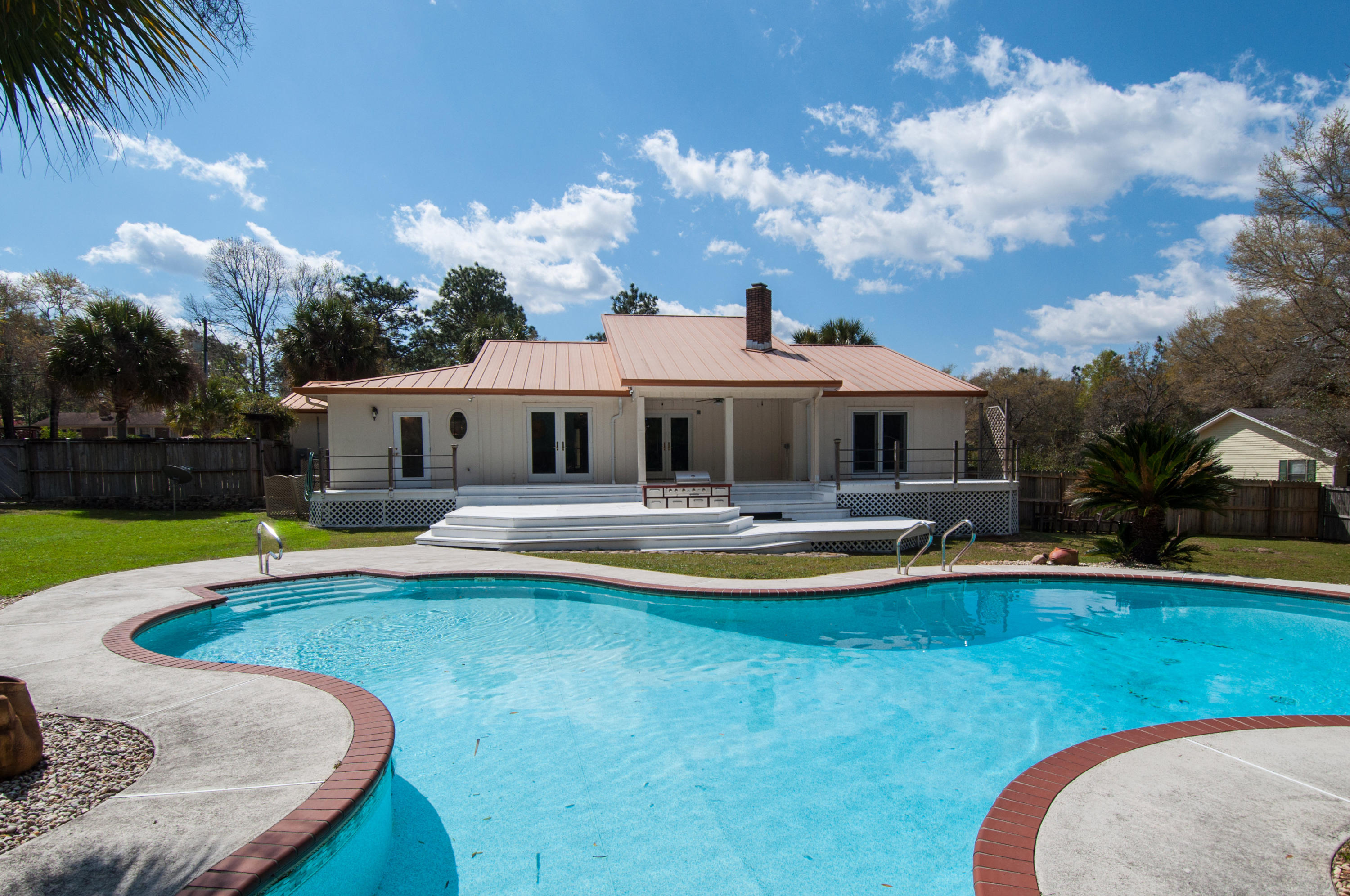 255 Ridge Lake Road Crestview, FL 32536 - Photo 9 of 54 a view of a house with swimming pool and sitting area