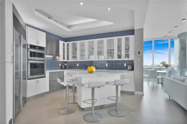 a kitchen with counter top space cabinets and stainless steel appliances