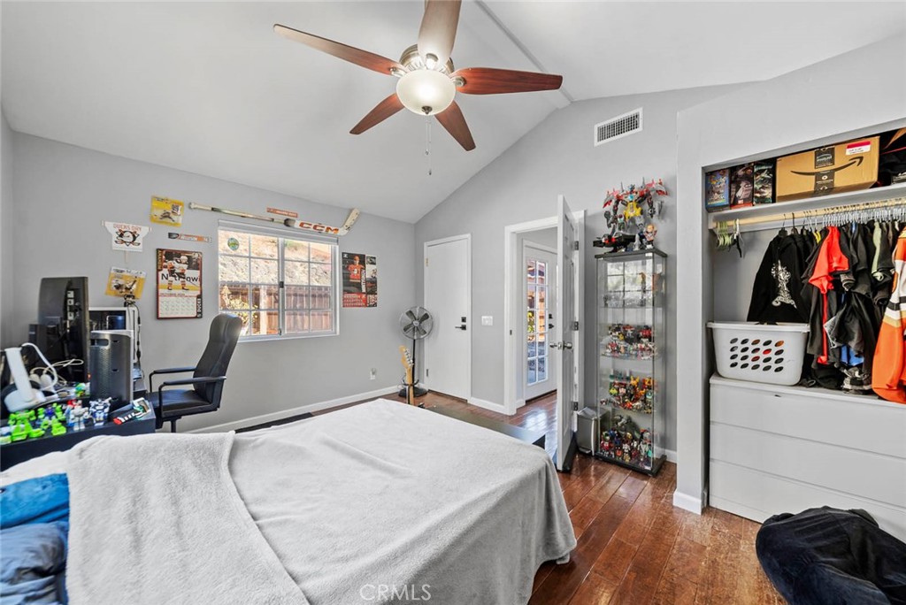 10634 Sanfred Court Santee, CA 92071 - Photo 14 of 44 a bed room with a bed and a walk in closet