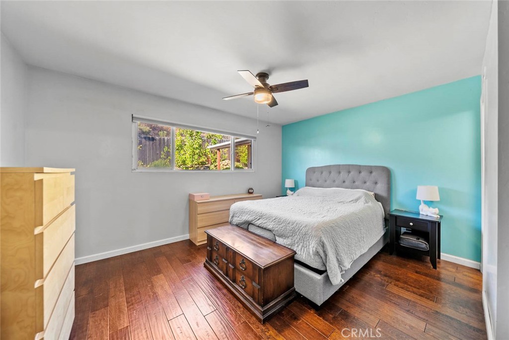 10634 Sanfred Court Santee, CA 92071 - Photo 20 of 44 a spacious bedroom with a bed and a table