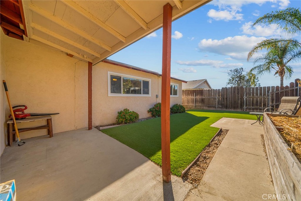 10634 Sanfred Court Santee, CA 92071 - Photo 26 of 44 a view of backyard with swimming pool and seating space
