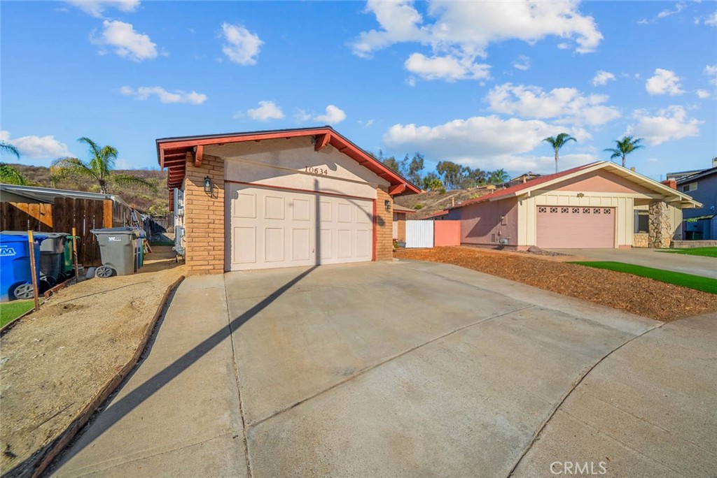 10634 Sanfred Court Santee, CA 92071 - Photo 32 of 44 a front view of a house with a yard