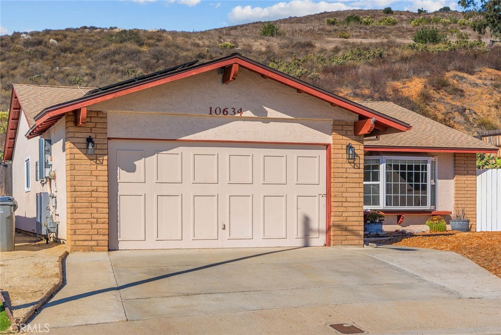 10634 Sanfred Court Santee, CA 92071 - Photo 35 of 44 a front view of a house with a yard