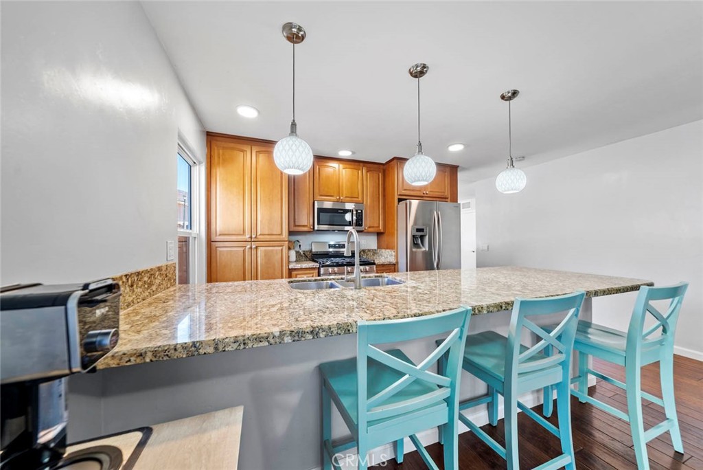 10634 Sanfred Court Santee, CA 92071 - Photo 9 of 44 a view of a dining table chairs and chandelier