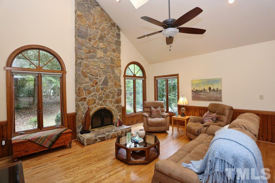 1420 Bascomb Drive Raleigh, NC 27614 - Photo 5 of 23 Soaring ceiling will greet you upon entering this home. Beautiful hardwood flooring, stone fireplace and encasement roll out windows.
