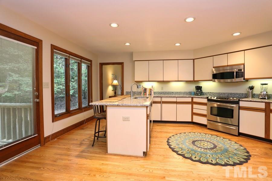 1420 Bascomb Drive Raleigh, NC 27614 - Photo 8 of 23 European cabinets and new granite are such great place to prepare your favoring meals. Lot of counter space and tons of cabinets and pantry.