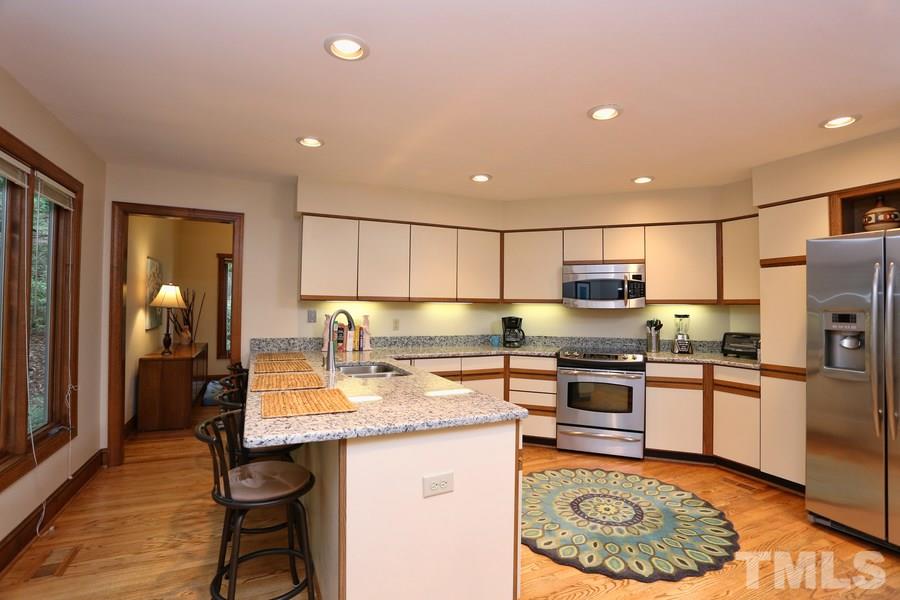 1420 Bascomb Drive Raleigh, NC 27614 - Photo 9 of 23 Enjoy this large breakfast bar on new granite.