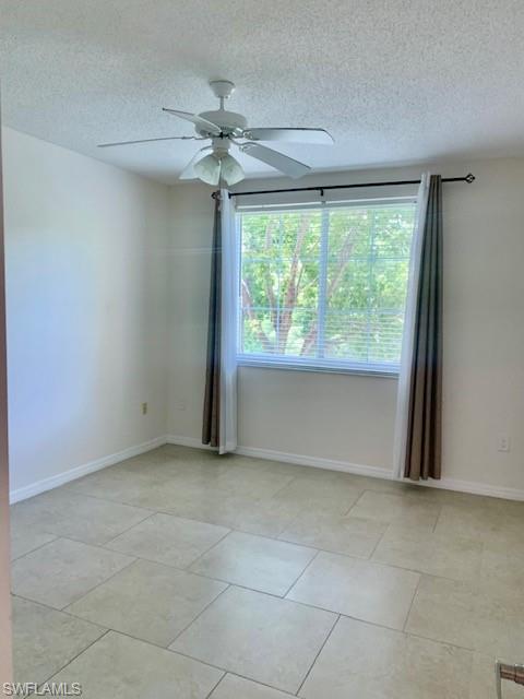 1180 Reserve Way, Unit 206 Naples, FL 34105 - Photo 6 of 22 a view of an empty room with a window