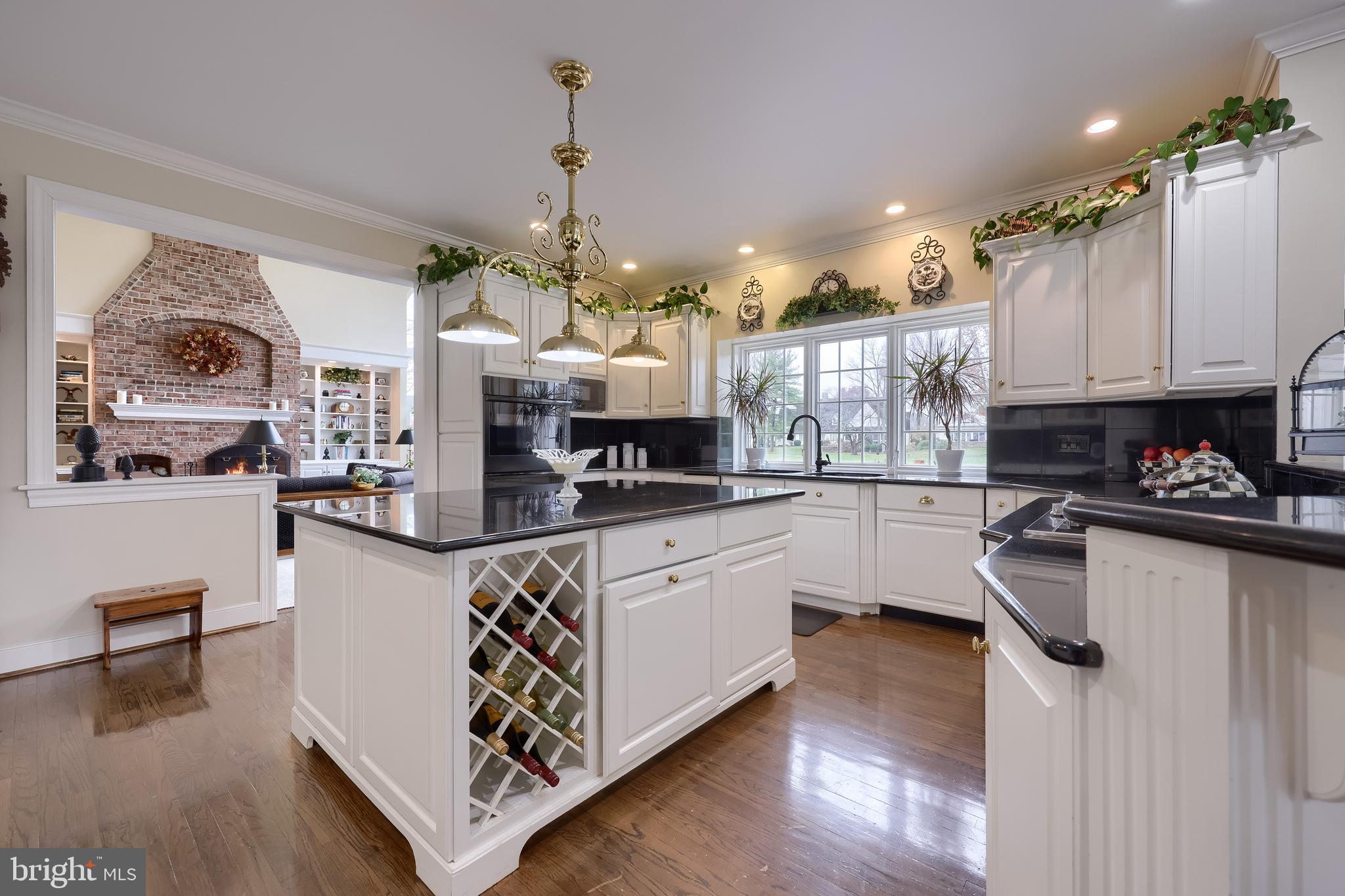 78 Oakhill Drive Lititz, PA 17543 - Photo 15 of 90 a kitchen with stainless steel appliances granite countertop a refrigerator a stove a sink dishwasher and white cabinets with wooden floor