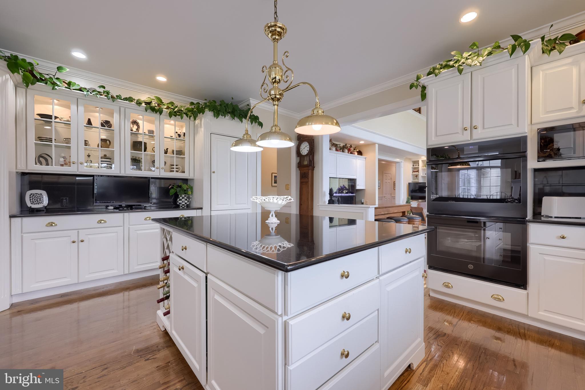 78 Oakhill Drive Lititz, PA 17543 - Photo 16 of 90 a kitchen with white cabinets and stainless steel appliances