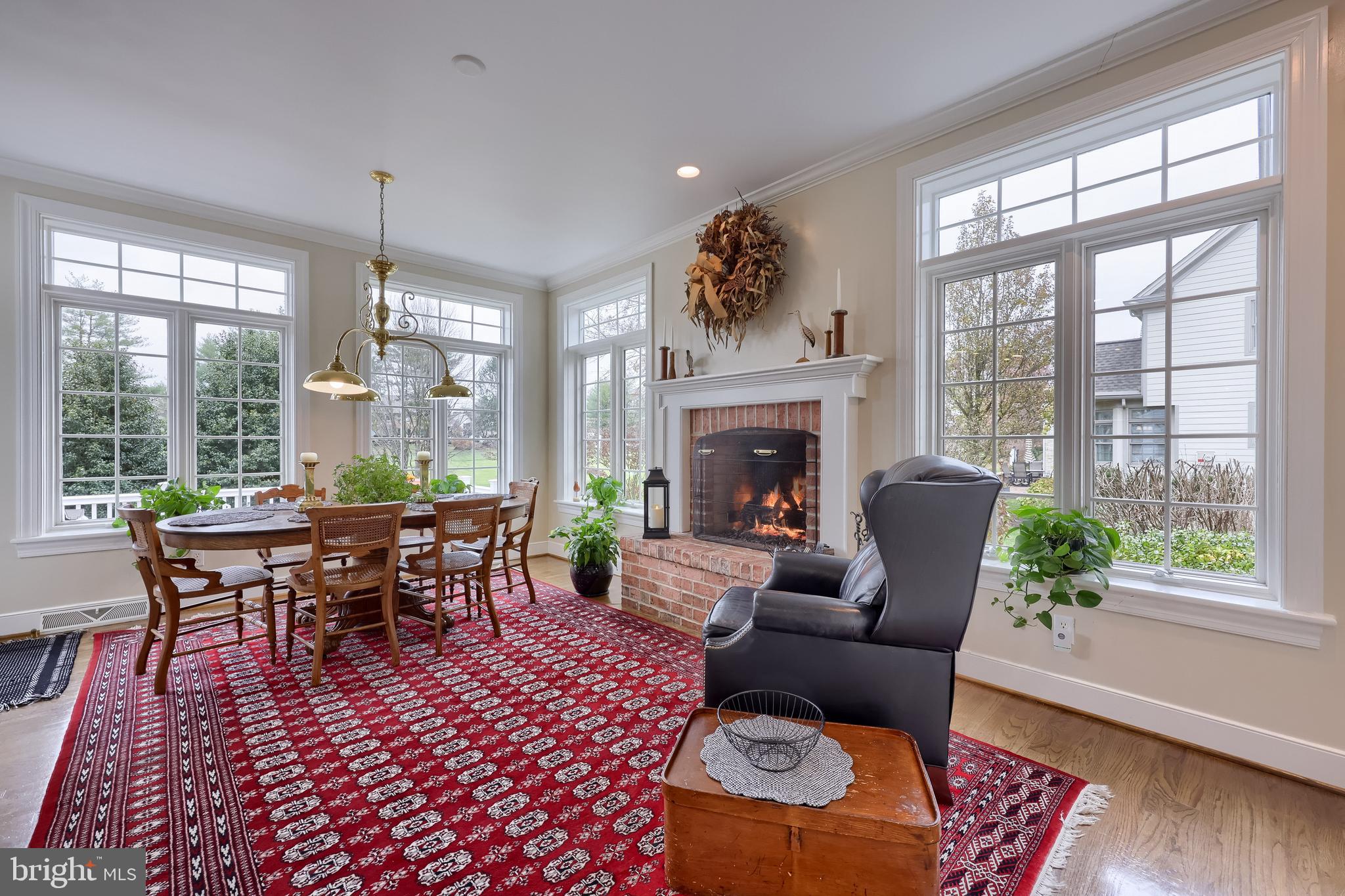 78 Oakhill Drive Lititz, PA 17543 - Photo 22 of 90 a living room with furniture a fireplace and a floor to ceiling window