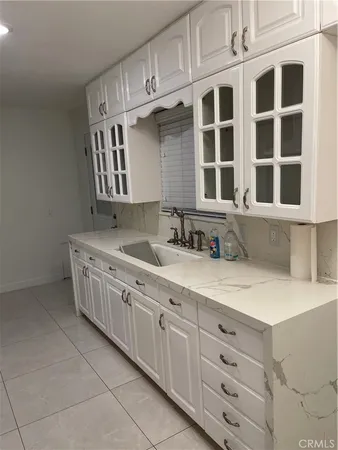 a kitchen with stainless steel appliances granite countertop a sink dishwasher stove and cabinets