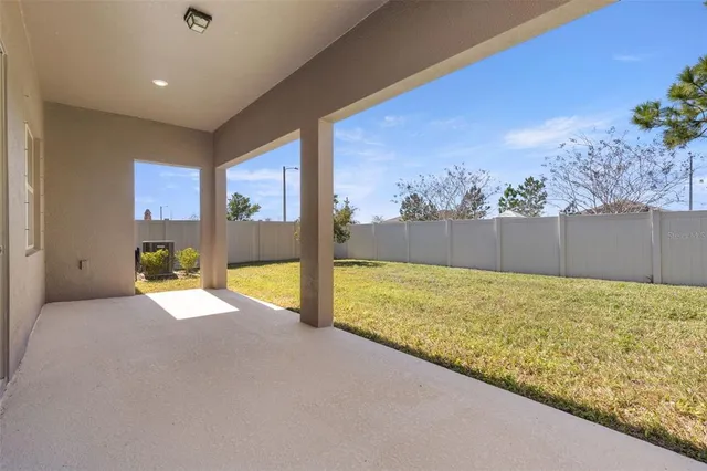a view of backyard with green space