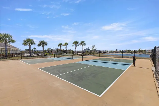 a view of a lake with houses in the back