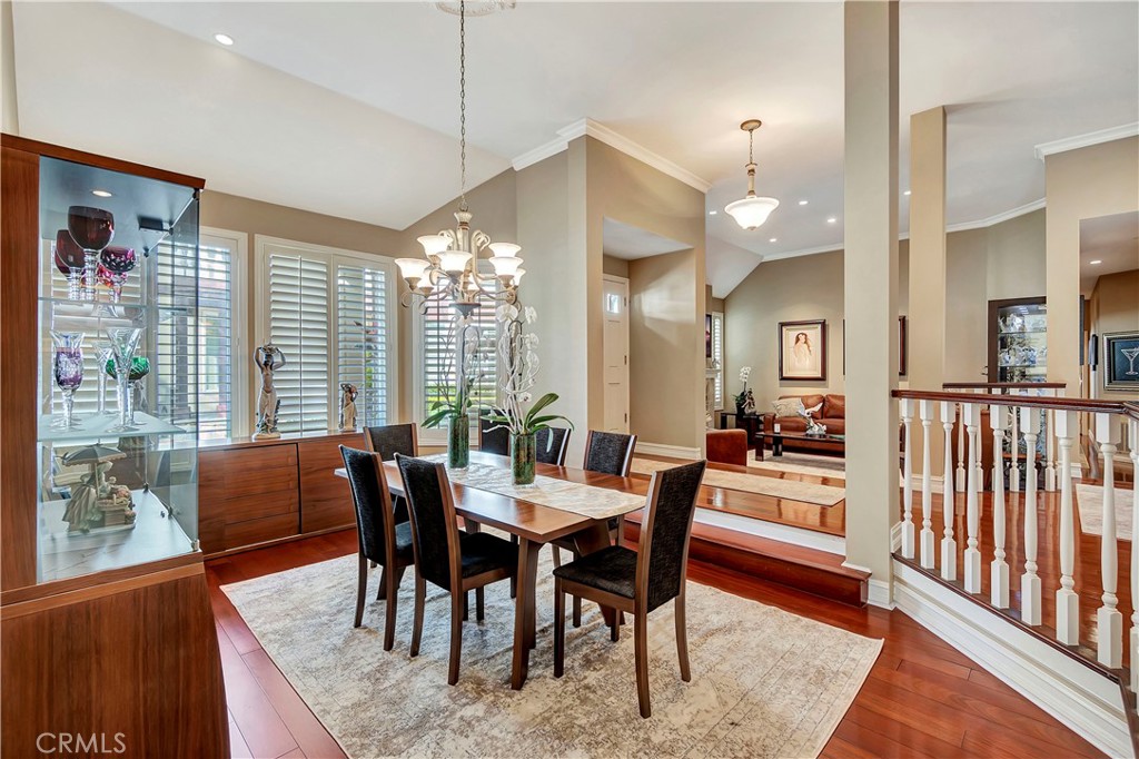 6096 Eaglecrest Drive Huntington Beach, CA 92648 - Photo 12 of 64 a view of a dining room with furniture window and wooden floor