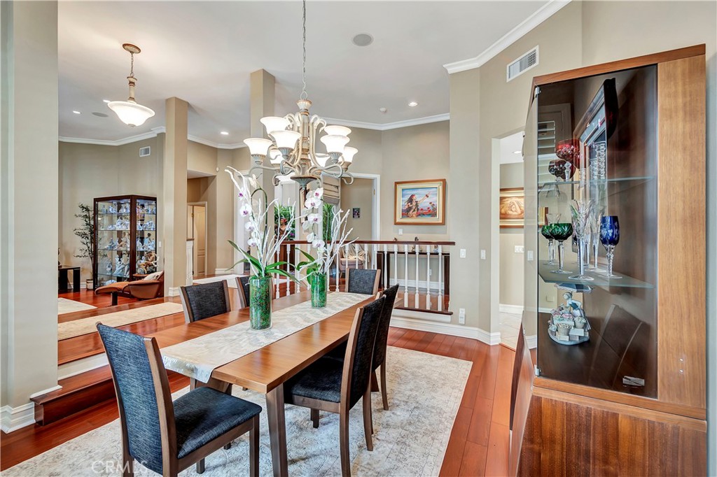 6096 Eaglecrest Drive Huntington Beach, CA 92648 - Photo 13 of 64 a view of a dining room with furniture and wooden floor