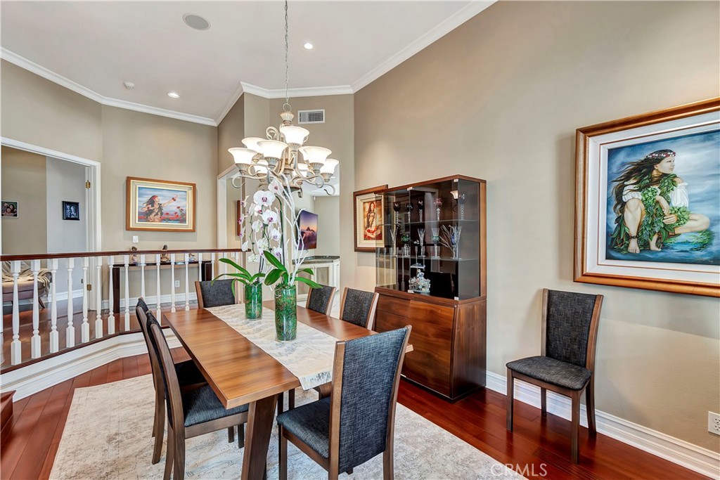 6096 Eaglecrest Drive Huntington Beach, CA 92648 - Photo 14 of 64 a dining room with furniture potted plants and wooden floor