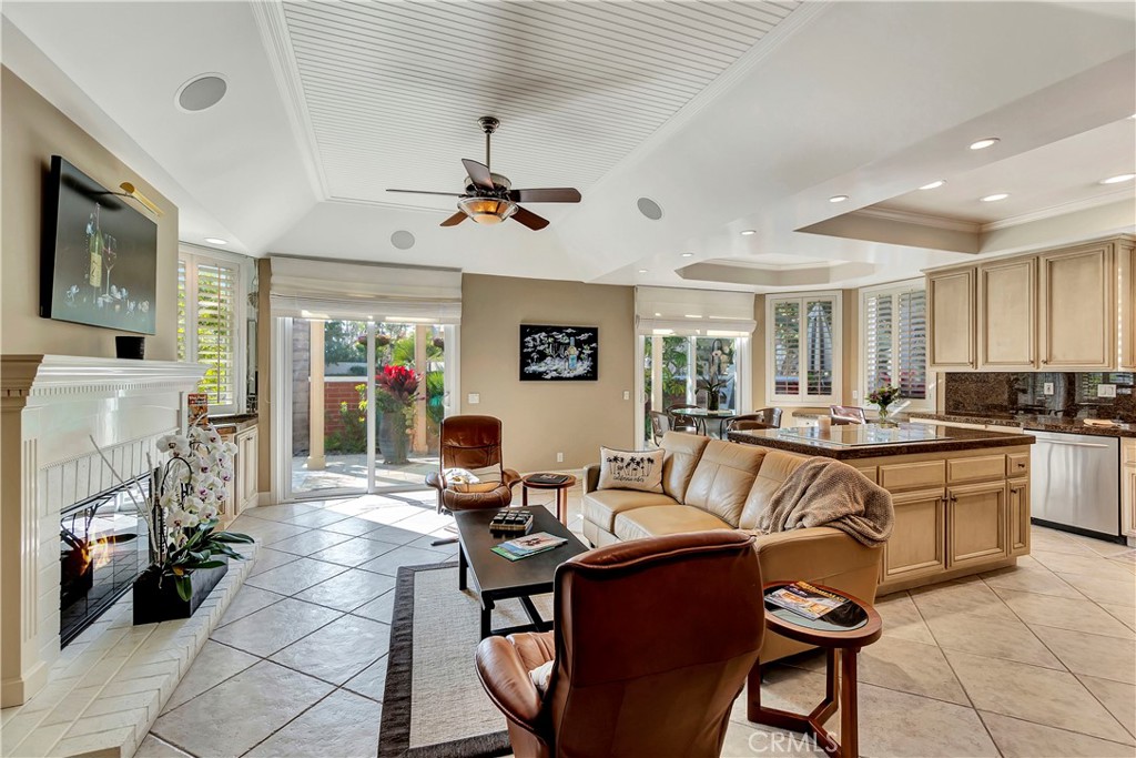 6096 Eaglecrest Drive Huntington Beach, CA 92648 - Photo 16 of 64 a living room with fireplace furniture and a flat screen tv