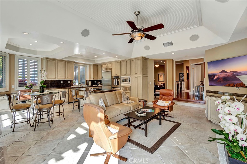 6096 Eaglecrest Drive Huntington Beach, CA 92648 - Photo 17 of 64 a living room with furniture and a flat screen tv