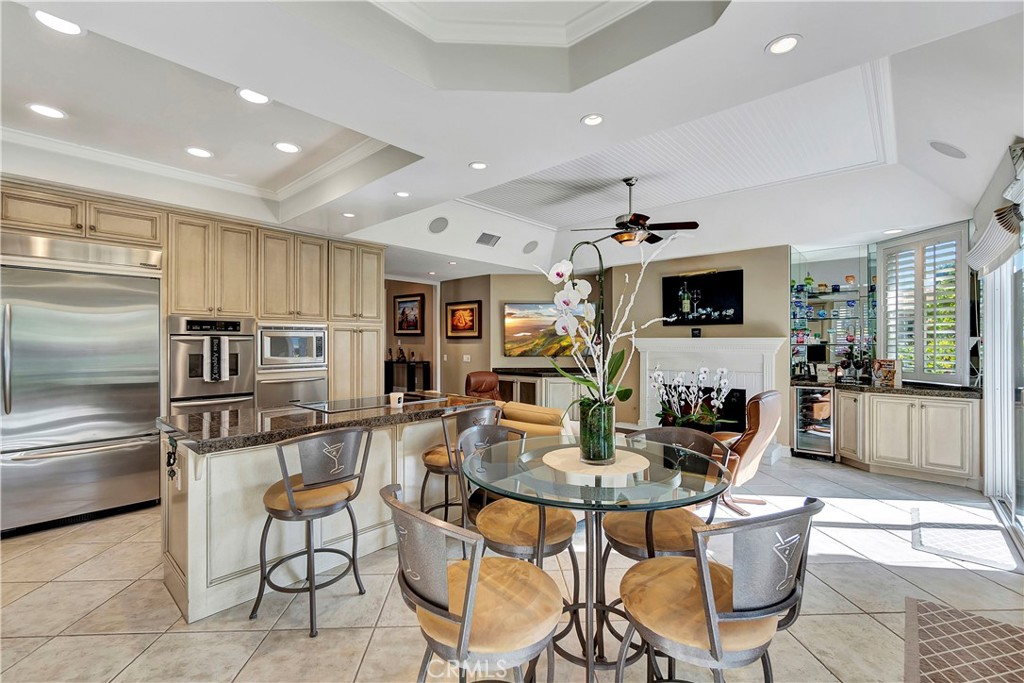 6096 Eaglecrest Drive Huntington Beach, CA 92648 - Photo 18 of 64 a kitchen with stainless steel appliances kitchen island granite countertop a sink and cabinets