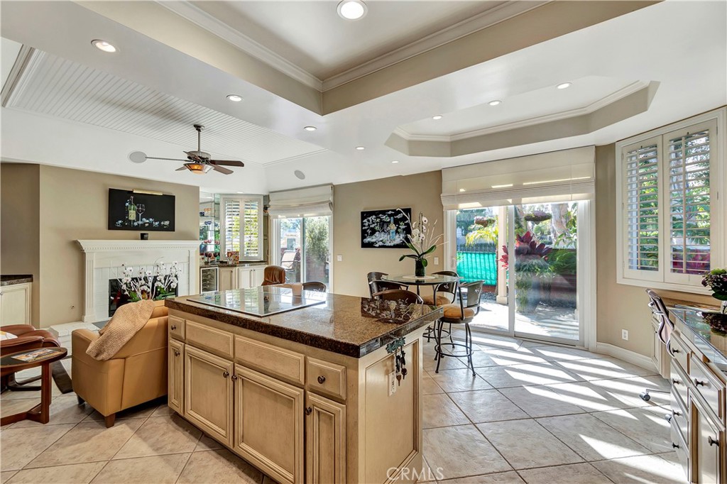 6096 Eaglecrest Drive Huntington Beach, CA 92648 - Photo 21 of 64 a kitchen with a sink a counter top space and living room view